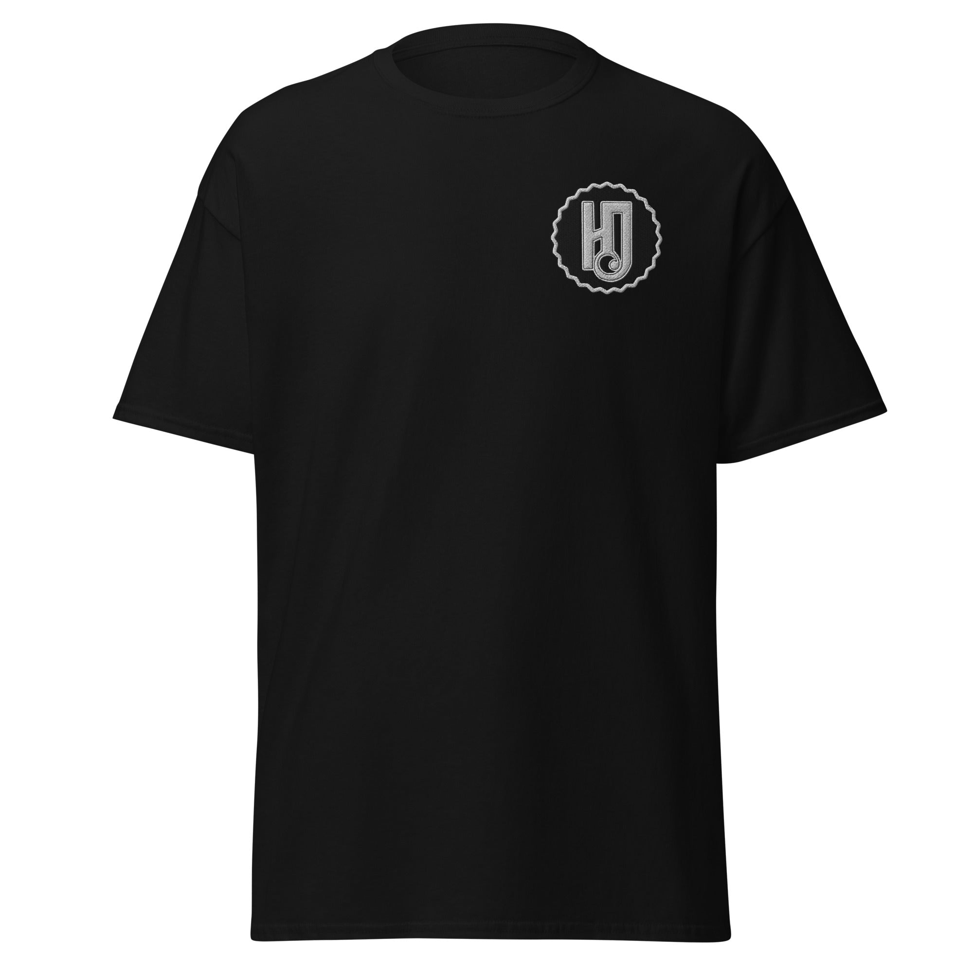 Front of the black Human Days Ignited Tee, showing the white and black embroidered HD logo on the left chest